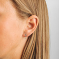 Diamond Dew earrings in 14-carat gold, as shown on the model