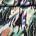 Viskosejersey med abstrakt print.