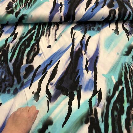 Viskosejersey med abstrakt print.