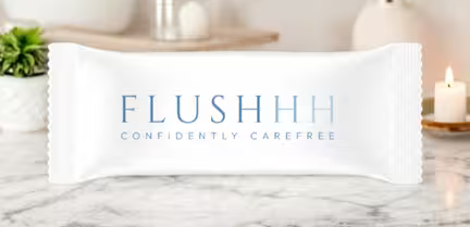 Viser en pakke Flushhh, der hjælper mod dårlige toiletbesøg