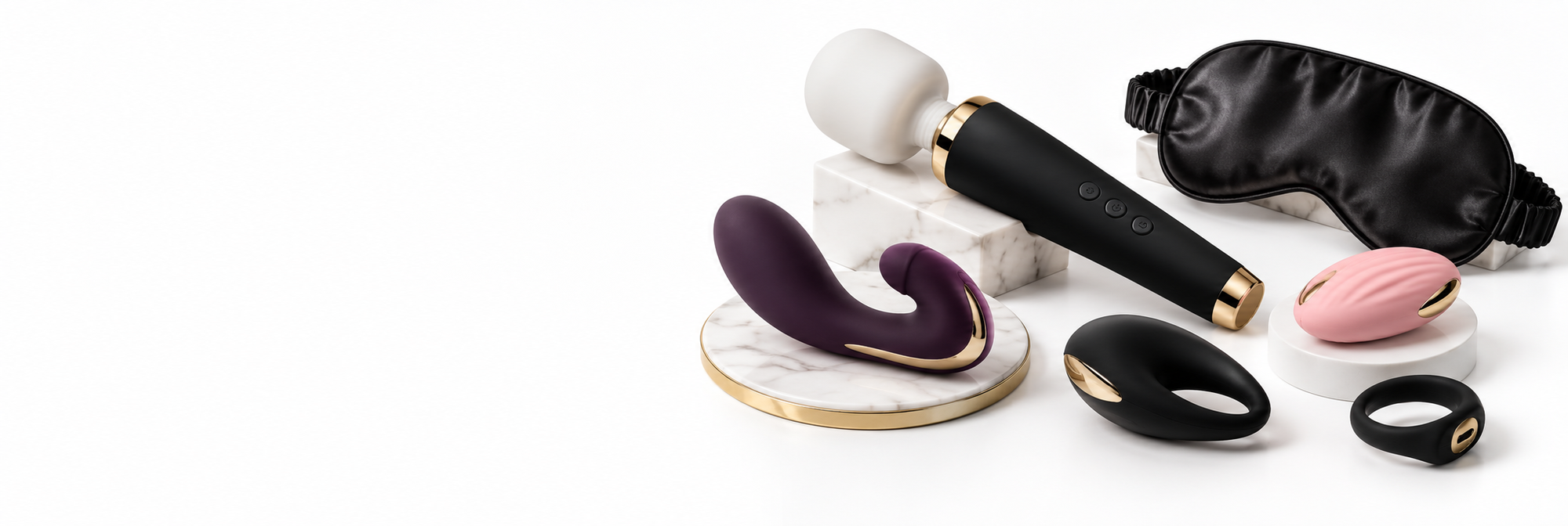 Udvalg af vibratorer, penisringe og satinmaske