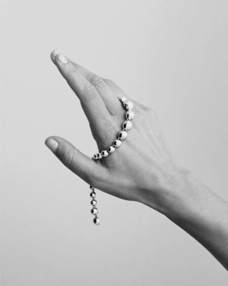 Model wearing BIGGEST BALL silver bracelet.