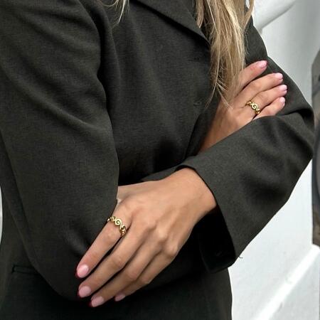 Curiosity ring made of 925 pure sterling silver plated with 18 karat gold plating.