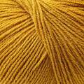 close up af garnnoegle merino fra knitting for olive i farven sennep
