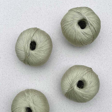 4 garnnoegler i kvaliteten arctic pearl fra pascuali i farven pistachio