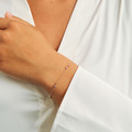 Four Seasons Petite bracelet in 14-carat gold, as worn by the model