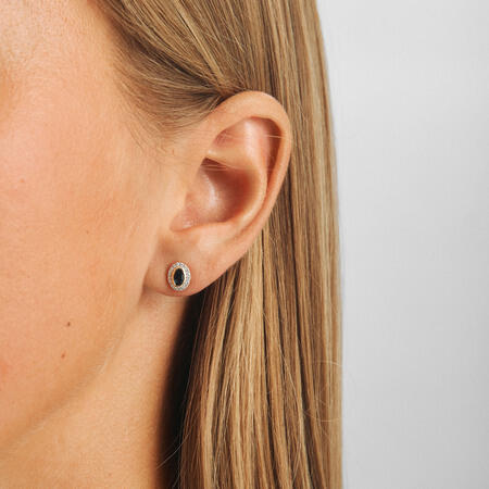 Victorian Secret 14-carat gold earrings on a model