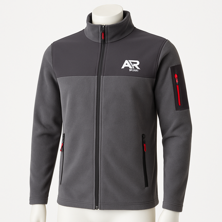 Grå fleecejakke med lynlås og røde detaljer, unisex pasform.