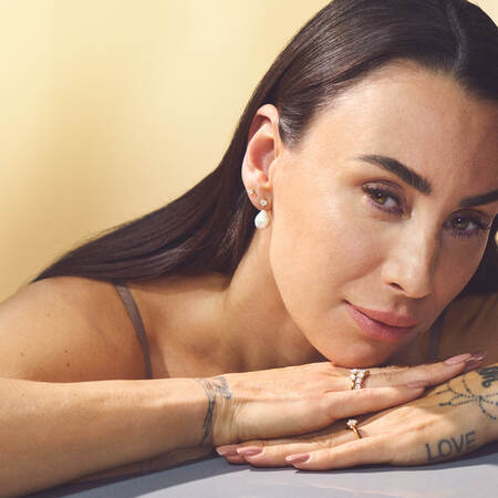 Medina wearing the CROWN ring in 14 karat gold with 0.50 ct. W.SI diamonds.