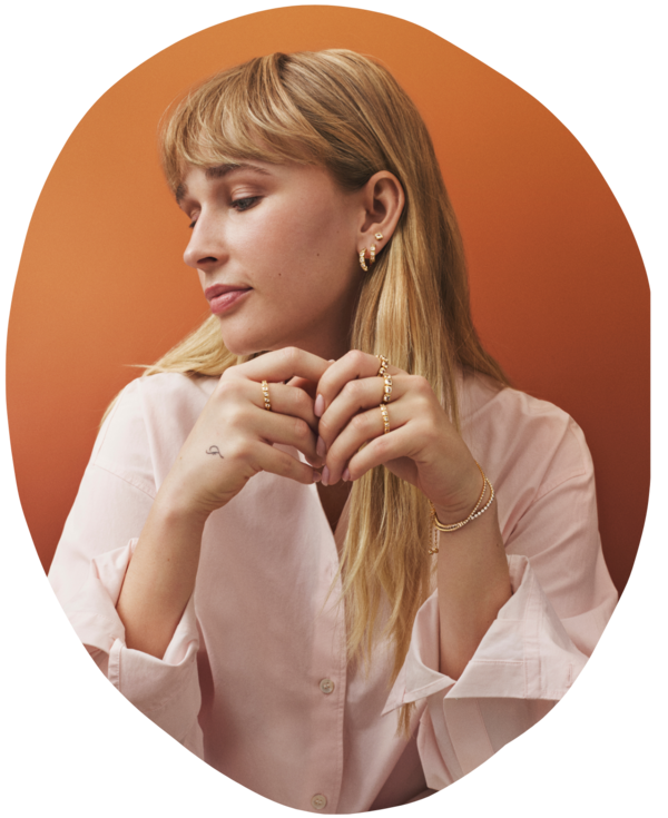 Designer and owner, Sara Ziegler, wearing jewelry from the Afterglow collection