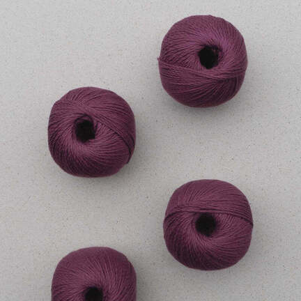 4 garnnoegler af market sole fra pascuali i farven mulberry