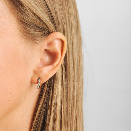 Endless Devotion earrings in 14-carat gold, shown on the model