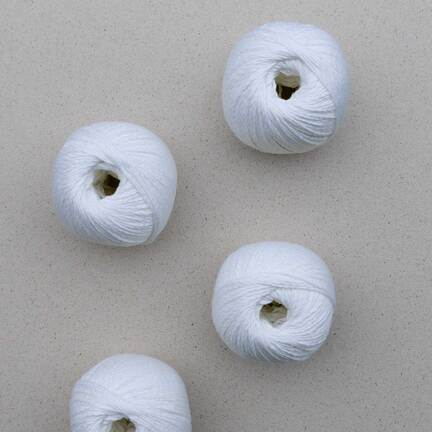 4 garnnoegler af market sole fra pascuali i farven hvid