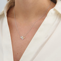 Fleur necklace in sterling silver with 14-carat gold and a 0.011 ct. brilliant-cut diamond on the design