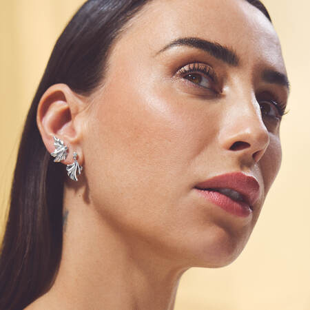 Medina wearing MONARCH silver earrings with white topaz.