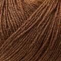 close up af garnnoegle merino fra knitting for olive i farven moerk cognac