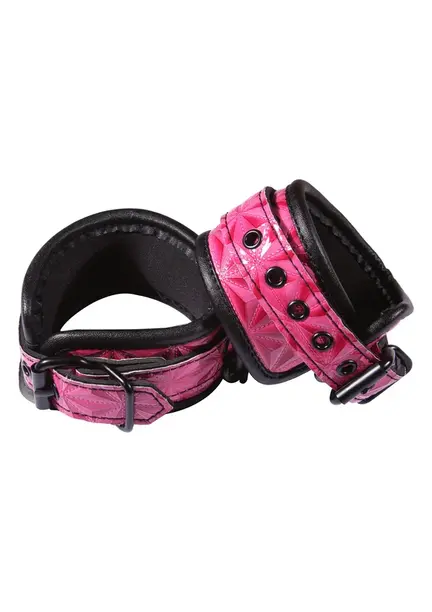 Pink og sorte justerbare håndledsmanchetter i vinyl og neopren til bondage og erotisk leg.
