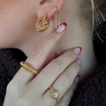 Sara wearing Seashell Secrets hoops made from 925 pure sterling silver plated with a durable 18 karat gold plating.