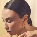 Medina wearing GOLDEN ORBIT earrings in 8 karat gold.