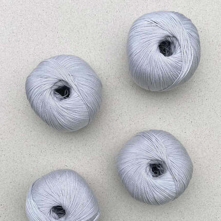 4 garnnoegler i kvaliteten arctic pearl fra pascuali i farven glacier 14