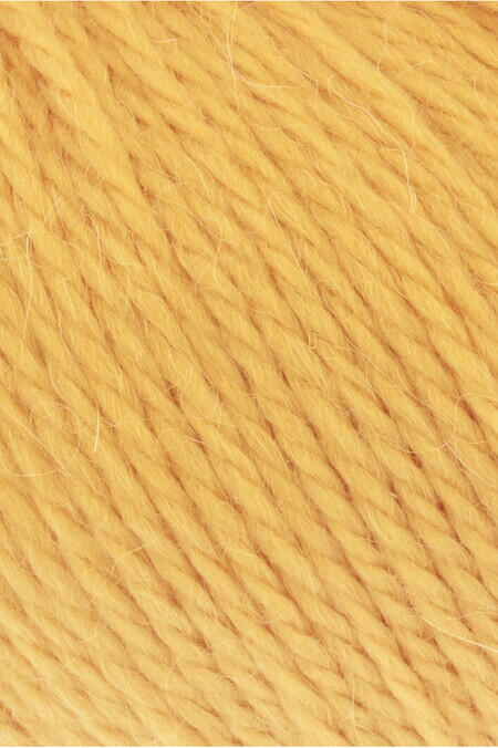 close up af garnnoegle af maerket carpe diem fra lang yarns i farven gul