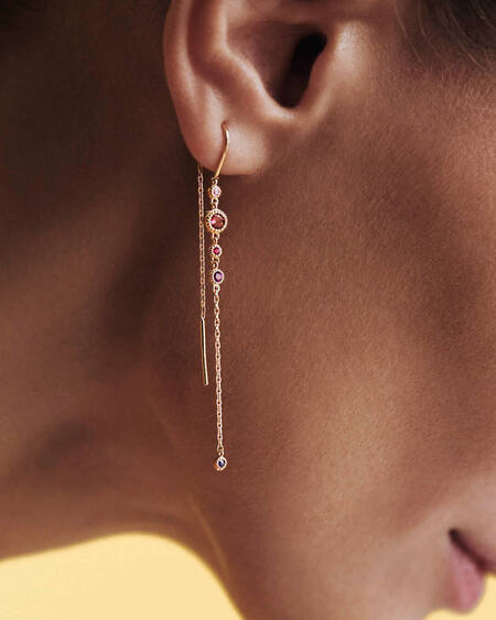 Model wearing LUXURY RAINBOW earrings in 14 karat gold with genuine pink sapphire, pink tourmaline, ruby, amethyst and sapphire.