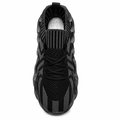 Sort futuristisk sneaker med bølget chunky sål på hvid baggrund