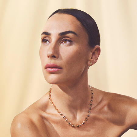 Medina wearing ASTRA LUX earrings in 8 karat gold.