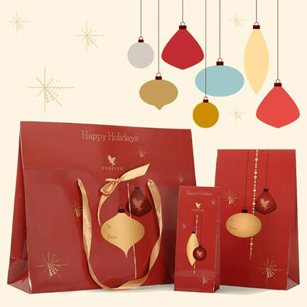 3 julegaveposer med en guld og en rød kugle