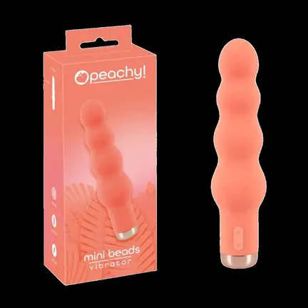 Peachy! Mini Beads vibrator i coral-pink med bølget form – kompakt og kraftfuld.