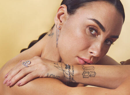 Medina wearing MIRA ring in silver with white topaz.