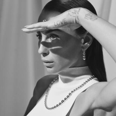 Medina wearing BIGGEST BALL earrings in 14 karat gold.