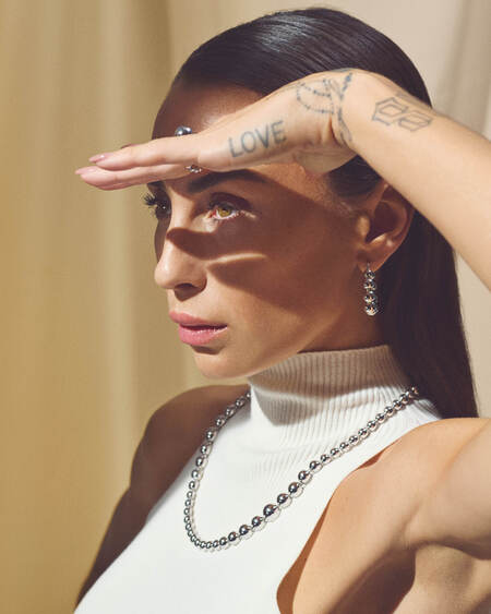 Medina wearing BIGGEST BALL earrings in silver.