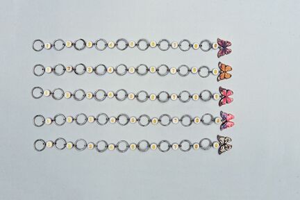 5 forskellige strikkefisk med sommerfugle