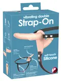 Vibrating Double Strap-On i hudvenligt materiale med vibrator og justerbare stropper.
