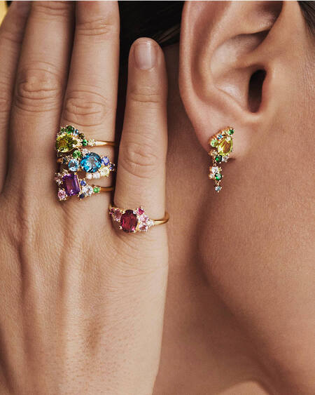 Model wearing FOUR SEASONS SPRING ring in 14 karat gold with genuine stones.