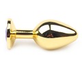 Gold metal anal plug med dekorativ sten, 3 cm diameter.