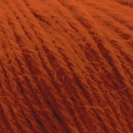 Close up af garnnoegle i angora fra mondial i farven brændt orange 726
