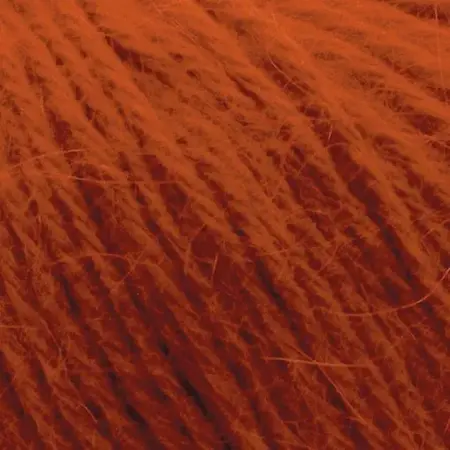Close up af garnnoegle i angora fra mondial i farven brændt orange 726