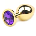 Gold metal anal plug med dekorativ sten, 3 cm diameter.
