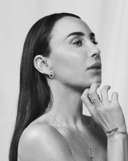 Medina wearing AURORAS KISS necklace in silver with white topaz.