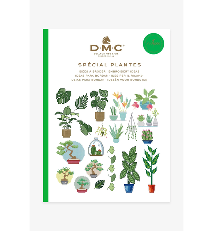 forside paa bog fra dmc med planter som broderimoenstre der er en masse broderede planter