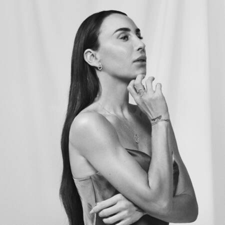 Medina wearing AURORA'S KISS necklace in silver with white topaz.