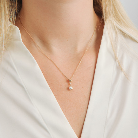 Moonchild pendant in 14-carat gold on a model