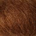 close up af garnnoegle soft silk mohair fra knitting for olive farven moerk cognac