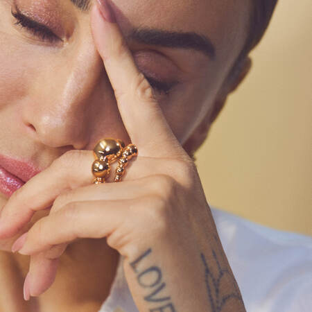 Medina wearing BIGGEST BALL ring in 14 karat gold.