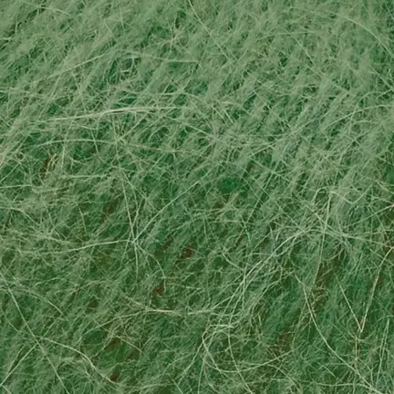 Close up af garnnoegle i angora fra mondial i farven grøn 727