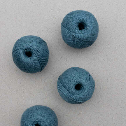 4 garnnoegler af market sole fra pascuali i farven ocean