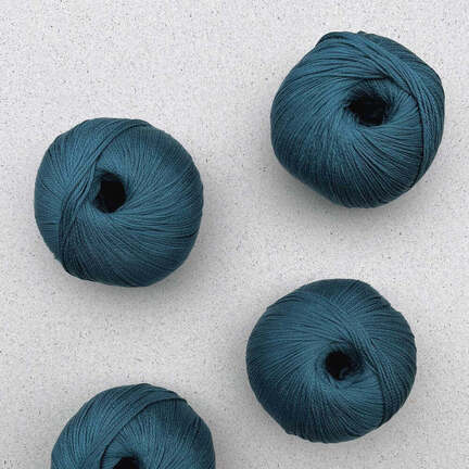 4 garnnoegler i kvaliteten arctic pearl fra pascuali i farven teal 15